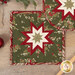 A closer look at the two Folded Star Hot Pads, demonstrating fabric color and print details.