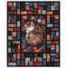 The completed Stained Glass Panel Quilt, colored in orange, magenta, cyan, and black fabrics from the Calico Cat collection by Timeless Treasures, isolated on a white background. 