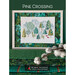 Front of pattern, showing the final stitched project in a wood frame on a mosaic Christmas tree design.