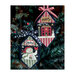 Snowman and house cross stitch ornaments on a Christmas tree.