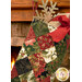 A close up of the décor-stuffed stocking, showing fabric color and print details.