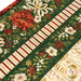 A super close up on the placemat, showing details on the fabrics used. A coordinating plate and fork peek into frame.