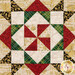 A super close up on one of the patchwork blocks, demonstrating details on the fabric prints, colors, and gold metallic accents.