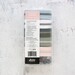 Assorted zippers and pulls in a clear plastic case with a label on top describing what is in the bundle.