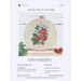 Front of pattern showing the completed cross stitch design with coordinating decor.