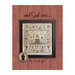 Finished And God Saw cross stitch pattern, with an old-timey design of animals, angels, a manor, trees, townsfolk, and a border of birds and florals hung on a red wood plank background.