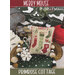 Holiday cross-stitch pattern cover with a stitched “Merry” stocking and Christmas decorations.