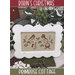 Framed cross-stitch of two robins on a Christmas-themed background.