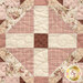 A super close up on one of the patchwork blocks, showing details on the fabric prints and colors.