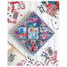 The Alice in Wonderland project finished and staged with cards, a book, and inspired details