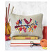 The Autumn Bird cross stitch pattern finished as a pillow and staged with decor
