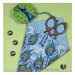 The completed peacock scissor case with a pair of scissor poking out. 