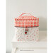 Front shot of an alternate style for the Cutie Cube Bag sitting on the corner of a white counter.