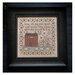 The completed cross stitch project featuring a brick house, a shepherd leading sheep, a bible phrase, and a floral border, in a black frame.