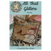 front cover of the All That Glitters pattern featuring the snowman cross stitch finished as a pillow with silver tinsel trim.