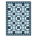 Blue and white Christmas quilt with an interlacing square block pattern.