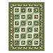 Green and cream Christmas quilt with a biased geometric block pattern.