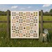 image of quilt on fence in a field