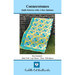 Cover of the finished Cornerstones quilt in a turquoise and yellow fabrics hung on a metal bench.