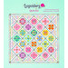 The completed Legendary quilt, colored in bright classic Tula colors, set against an aqua green background with a text graphic at the top.
