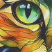 A zoomed in fabric panel featuring the eye of the cat motif. 