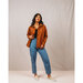 Model wearing a copper colored regular length Ilford jacket and blue denim jeans.