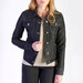 Model wearing a dark denim jean jacket.
