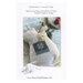 Back cover of the booklet with a photo of the finished pocket on the skunk plush attached with scissors nestled inside.