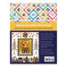 Back of the Quilt Panel Magic book with the finished Santa's Coming! and Hip to be Square quilts on display.