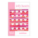 The front of the Jelly Hearts quilt pattern by Modernly Morgan with the finished quilt isolated on a pink and white background.