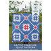Front cover of the Arctic Sparkler Quilt Pattern featuring the blue, red, and white finished quilt displayed outside.