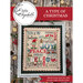 A finished and framed of the A Type of Christmas pattern with coordinating décor and a stitch count in the bottom right corner. 
