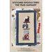 Cross-stitch pattern cover showing a winter hat, bow, and red house under the title January.