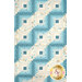 A closer look at the quilt, showing details on the patchwork layout.