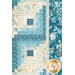 A close up on the patchwork of the quilt, demonstrating fabric prints and color details.
