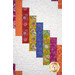 A super close up on the patchwork of the quilt, demonstrating fabric colors and print details.