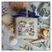 The completed project, a small seaside village, staged with coordinating nautical decor.