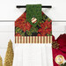 A close up on the top section of the towel, showing details on the bell fabric as well as the fabric button.