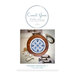 Front cover of the Porcelain Stitches No. 1 cross stitch pattern in a rich wooden circle hoop surrounded by a vintage inspired scene.