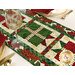 A close up on one end of the runner, showing patchwork details on the present blocks and poinsettia border.