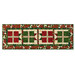 The completed A Gift for You Table Runner, colored in red, green, and white, and gold metallic fabrics from the Poinsettias at Christmas collection by Jennifer Bosworth for Riley Blake Designs, isolated on a white background. 
