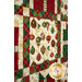 A close up on the patchwork of the quilt, demonstrating print and color details on the fabrics.