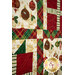 A close up on the patchwork of the quilt, demonstrating print and color details on the fabrics.
