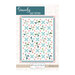 Front of the Sincerely Quilt Pattern by Flamingo Toes featuring a pastel quilt with x marks and pinwheels.