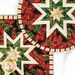 A closer look at the two Folded Star Hot Pads, demonstrating fabric color and print details.