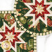 A closer look at the two Folded Star Hot Pads, demonstrating fabric color and print details.