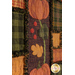 A close up on the appliqué of the project, showing print and stitching details on a pumpkin, vine, leaves, and berries.
