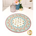 The completed Point of View Folded Star Table Topper, colored in serene shades of blue, pink, and cream fabrics from the Woodland Heart collection by Northcott Fabrics, staged on a white table with coordinating décor.