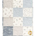 A close up on the patchwork, showing details on the blue, white, and taupe fabrics.