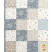 A close up on the patchwork, showing details on the blue, white, and taupe fabrics.